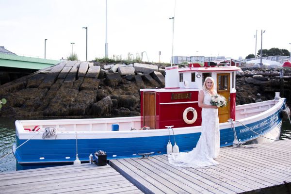 Maine Bride boarding boat to Wedding reception